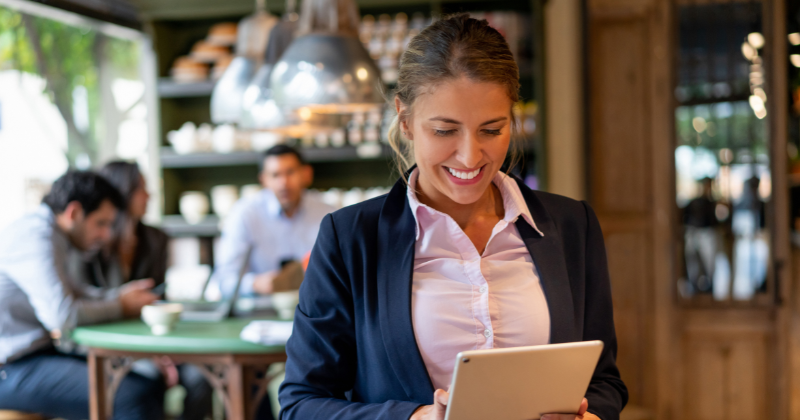 restaurant worker looking at ipad