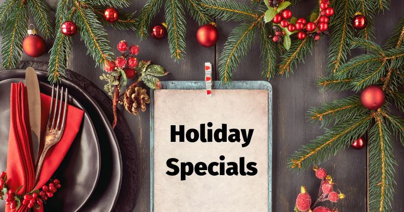 festive table setting with clipboard reading "Holiday Specials"